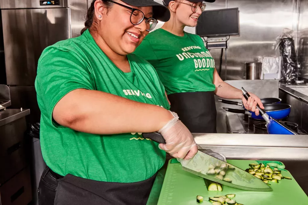 Noodles Employees Preparing Uncommonly Good Food