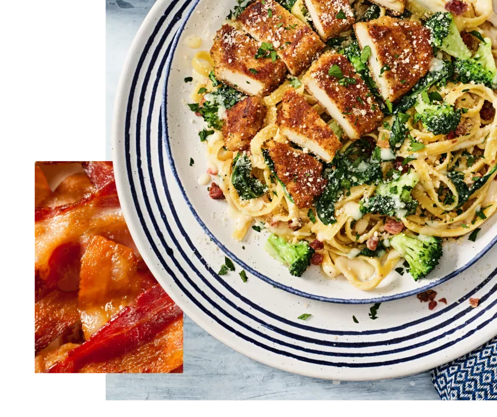 Crispy Chicken Bacon Alfredo dish on a white plate, with a detail close-up of bacon.