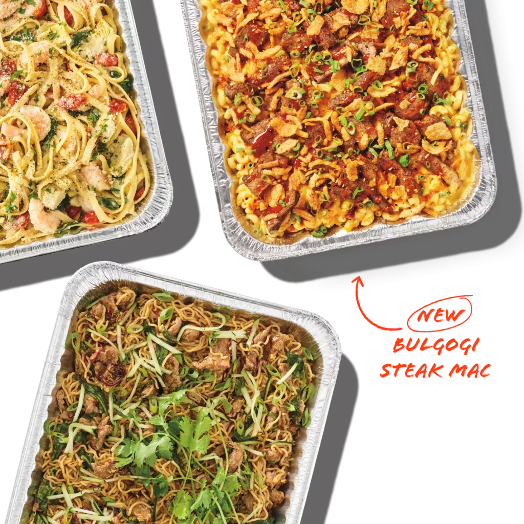Catering pans of Bulgogi Steak Mac &amp; Cheese, Lemon Garlic Scampi and Spicy Korean Steak Noodles. Graphic that says, &quot;New Bulgogi Steak Mac&quot;.