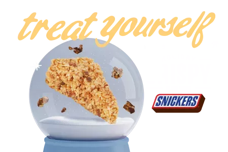 Treat yourself with a holiday crispy made with snickers. Image of a holiday crispy in a snowglobe.