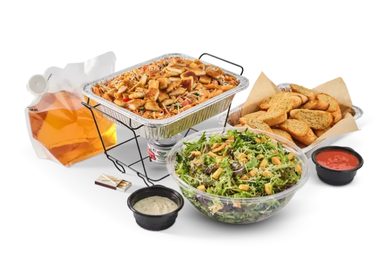 Noodles & Company catering pasta pan, dessert, drink, and salad.