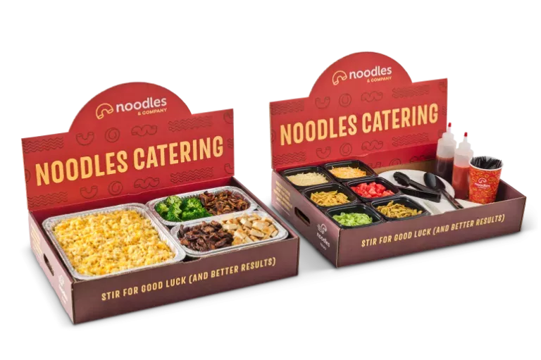 Noodles & Company mac and cheese pan with variety of toppings and sauces.