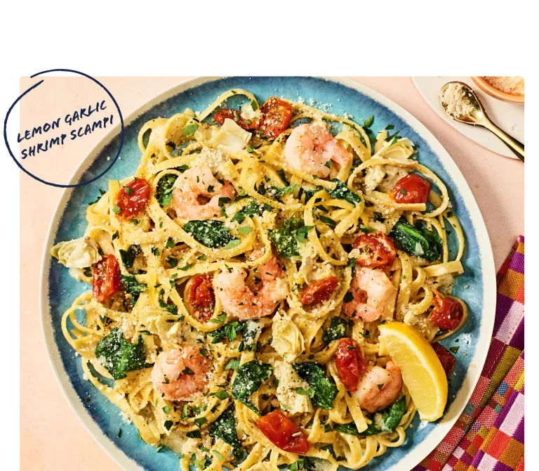 Noodles & Company's Lemon Garlic Shrimp Scampi on blue plate with napkin