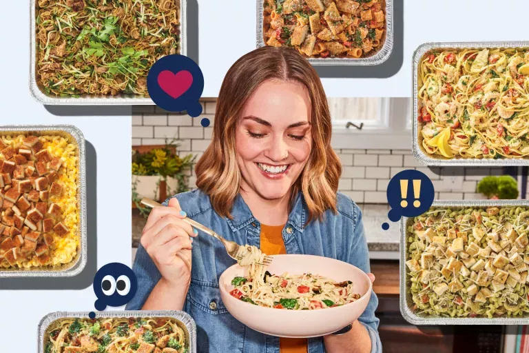 Noodles &amp; Company customer enjoying a serving of noodles with multiple catering options in pans surrounding the customer.