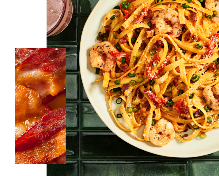 Bacon and cajun shrimp fettuccine on table top.